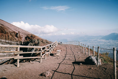 Walkway on mountain against sky