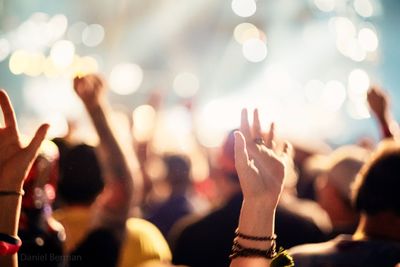 Close-up of hands at music concert