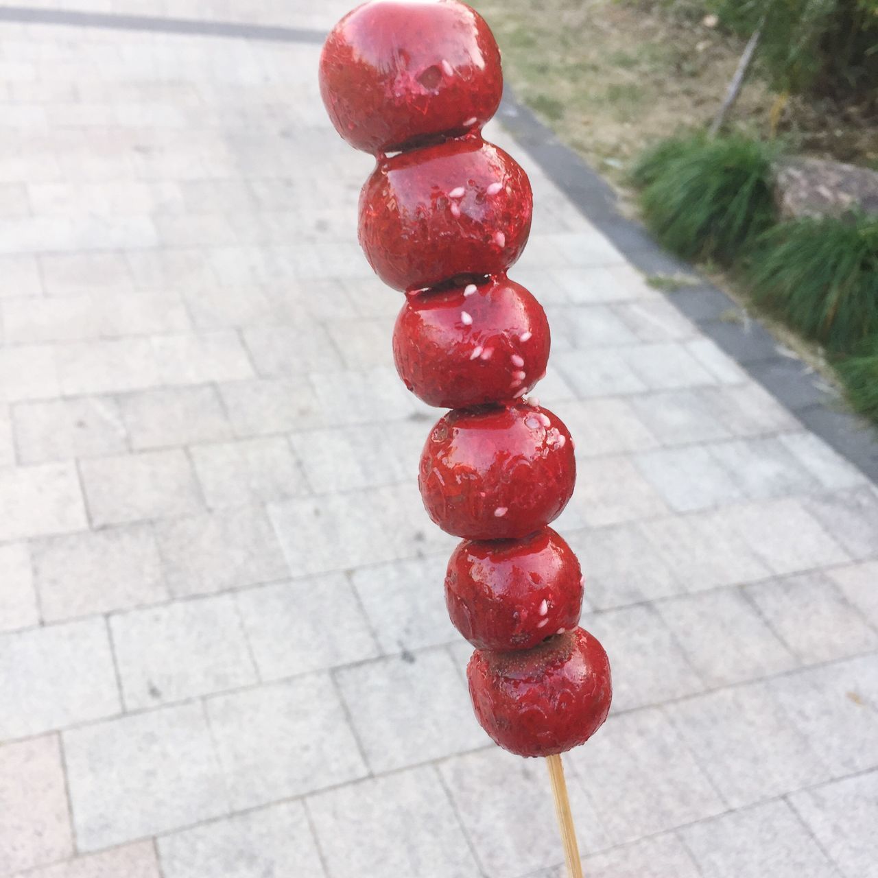 red, fruit, day, outdoors, food and drink, no people, high angle view, sidewalk, nature, walkway, food, healthy eating, freshness, close-up