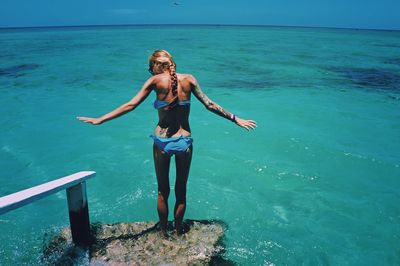 Full length of woman swimming in sea