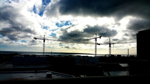 Cityscape against cloudy sky