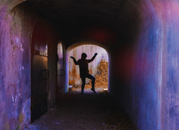 Full length of man standing in tunnel