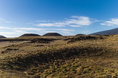 Scenic view of arid landscape against sky