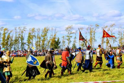 People on field against sky