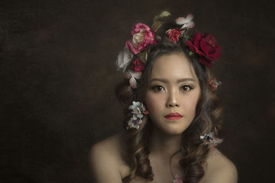 Portrait of beautiful woman wearing flower