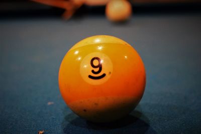 Close-up of yellow ball on table