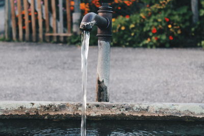 Close-up of water falling from faucet