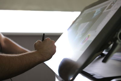 Close-up of man working at bus