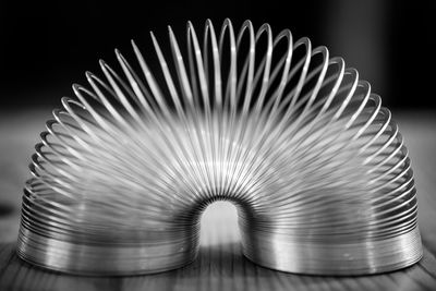 Close-up of coiled spring on table