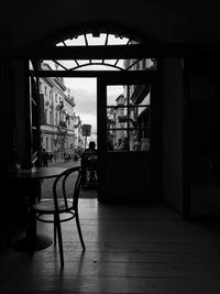 Empty chairs and tables in building