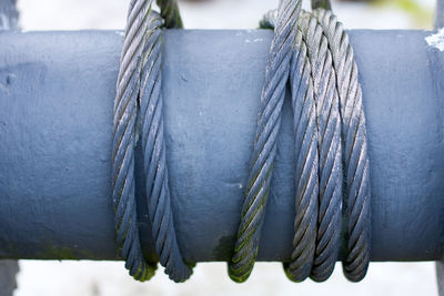 Close-up of steel cable rolled on metallic spool