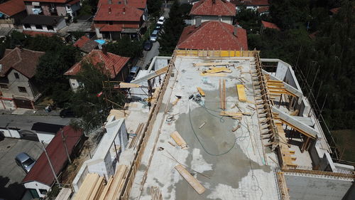 High angle view of construction site by buildings in city