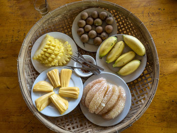 High angle view of fruits in plate on table