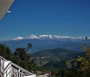 Scenic view of mountains against clear blue sky