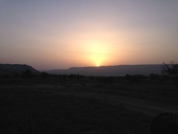 Scenic view of landscape at sunset