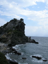 Scenic view of sea against cloudy sky