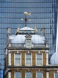 Low angle view of building against blue sky