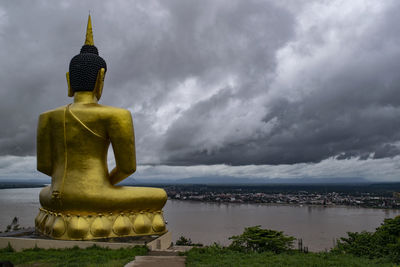 Statue of buddha against sky