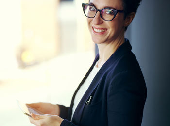 Portrait of businesswoman holding tablet pc