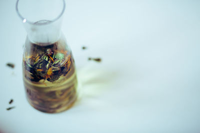 Close-up of jar over bottle