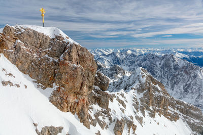 Scenic view of snowcapped mountains against sky