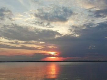 Scenic view of sea against sky at sunset