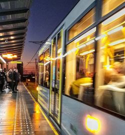 Blurred motion of train in city at night