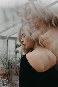 Portrait of young woman looking at camera