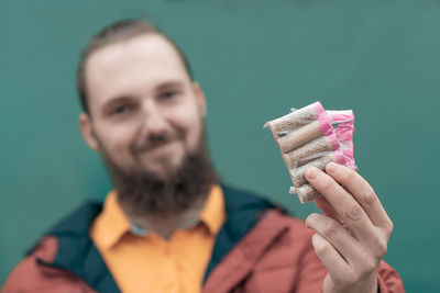 Portrait of a man holding ice cream