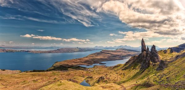 Panoramic view of sea and mountains against sky