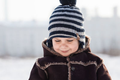 Portrait of smiling girl in snow