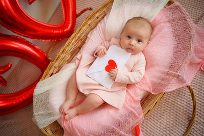 Valentine's day, little girl with valentine envelope