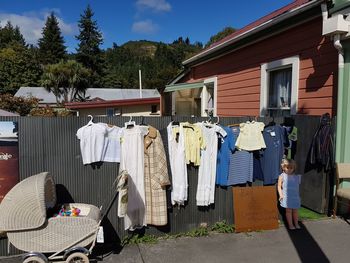 Clothes drying outside house against building