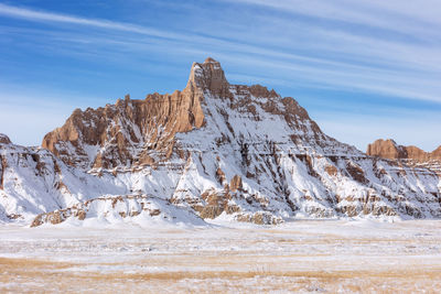 Scenic winter landscape with snow in badlands national park, south dakota.