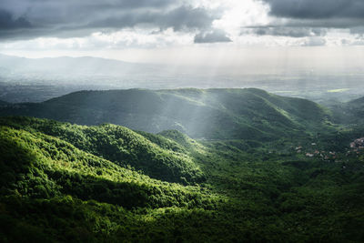 Scenic view of landscape against cloudy sky