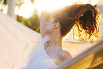 Side view of young woman looking away