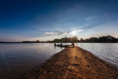 Scenic view of lake against sky during sunset