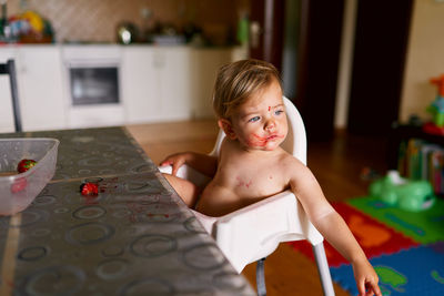 Portrait of shirtless boy at home