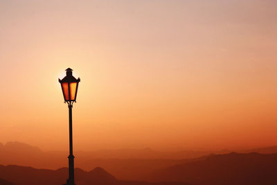 Low angle view of street light against sky