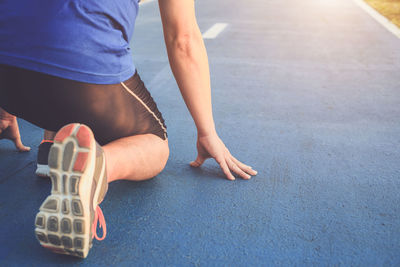 Man in starting position on road