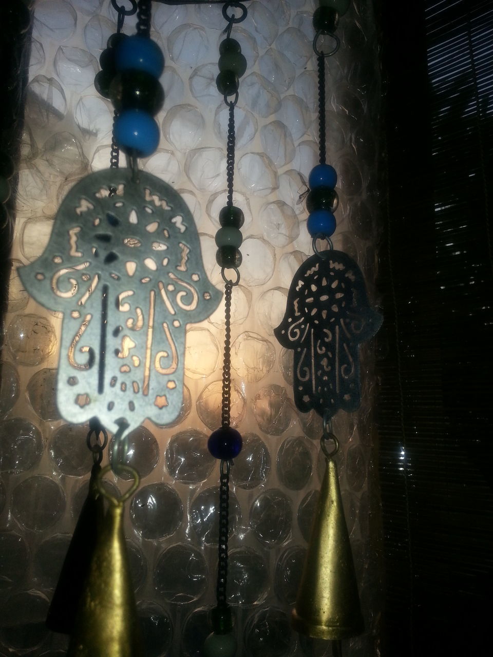 LOW ANGLE VIEW OF ILLUMINATED LIGHTS HANGING FROM CEILING AT MOSQUE