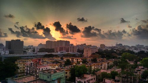 High angle view of buildings against sky during sunset