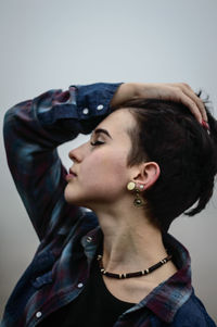 Woman with short hair outdoors during foggy weather