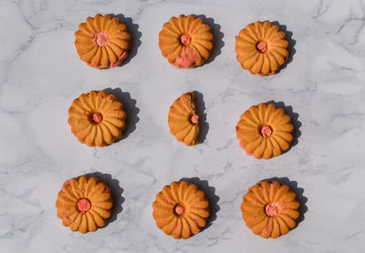High angle view of orange leaves against white background