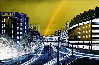 Built structures against sky at sunset