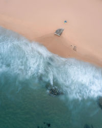 High angle view of waves in sea against sky