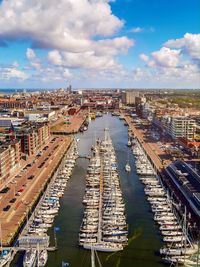 High angle view of harbor amidst buildings in city