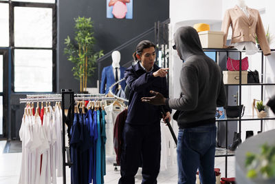 Rear view of people standing in store