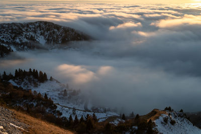 Scenic view of snow covered mountains against sky