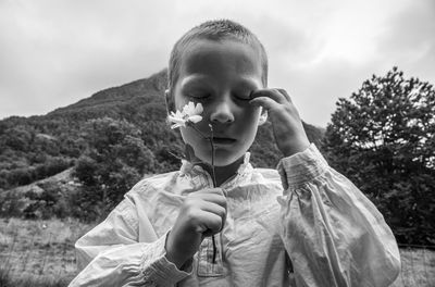 Portrait of boy holding camera